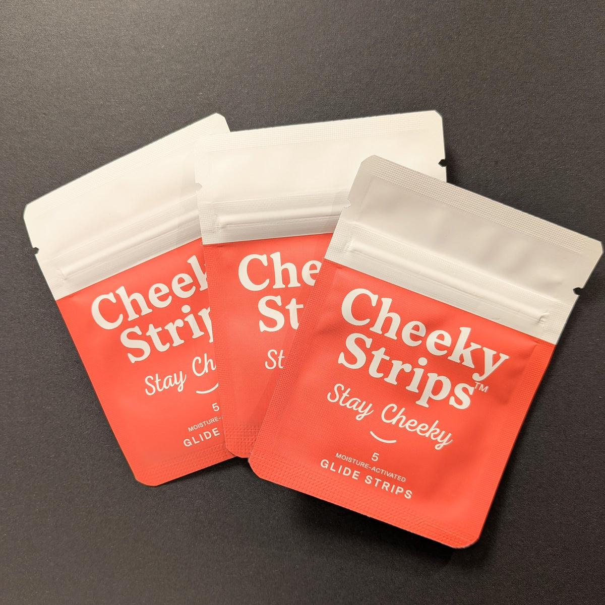 Three Cheeky Strips pouches, 15 glide strips total