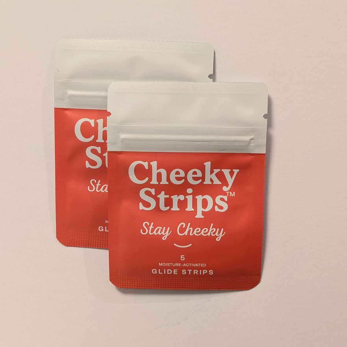 Cheeky Strips Hero Duo, two pouches of moisture-activated glide strips