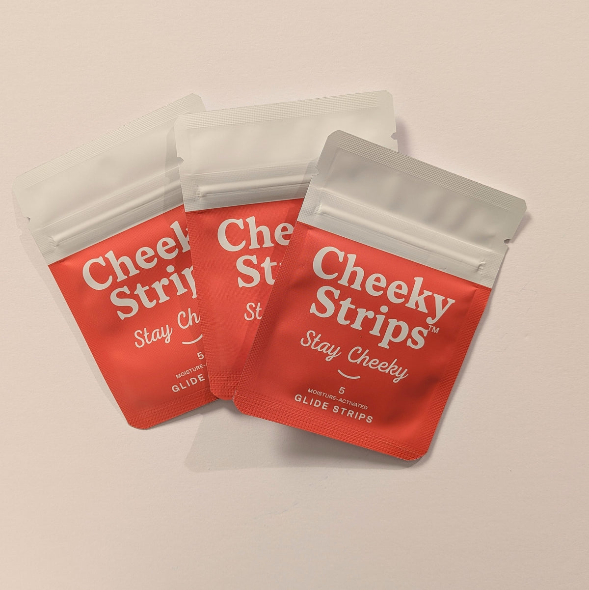 Cheeky Strips Hero 3-Pack, three pouches of moisture-activated glide strips